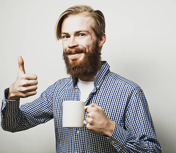istock man with a cup of coffee 474043918