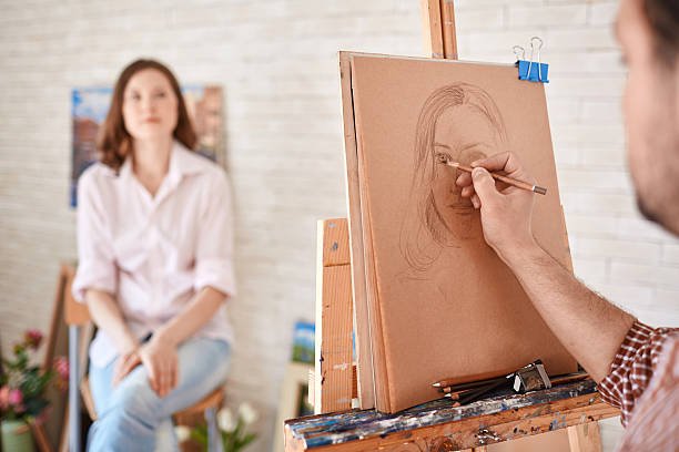 アーティストの描出 - women artist painting easel ストックフォトと画像