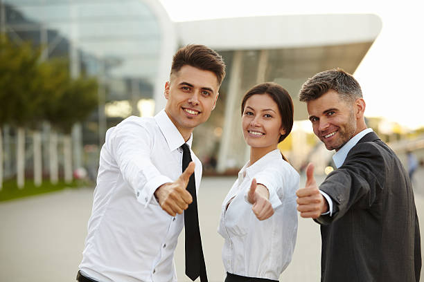 istock Business people giving thumbs up. 474045364
