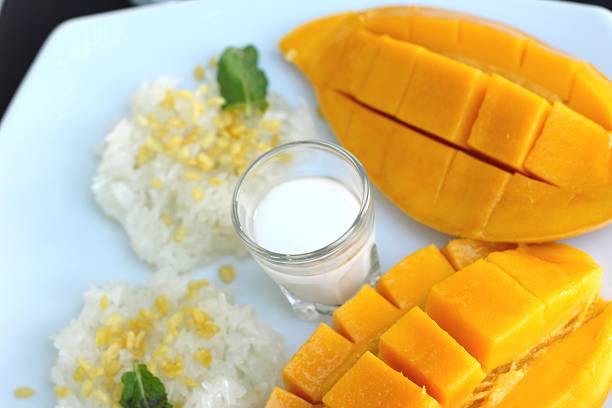 istock sticky rice with coconut milk mix and ripe mango. 474046114