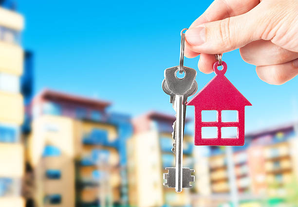 istock Handing keys in the house background 474046452