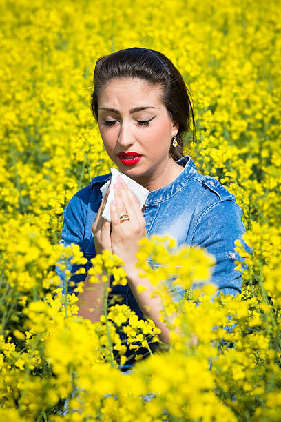 istock Young woman in a field has hay fever 474046812