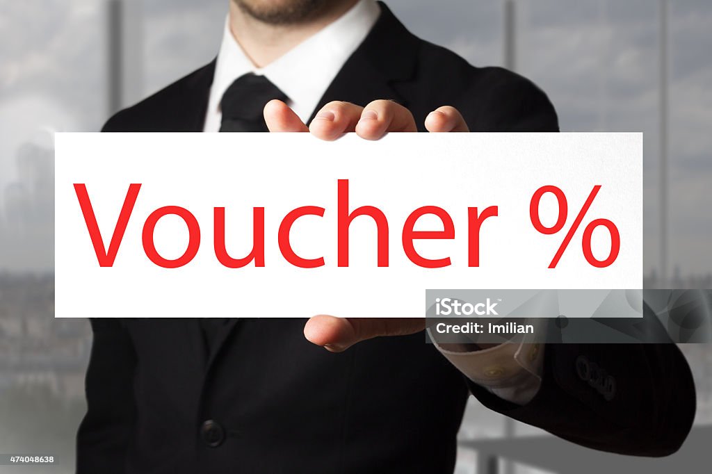 businessman holding sign voucher percentage symbol businessman in black suit holding sign voucher percentage symbol 2015 Stock Photo