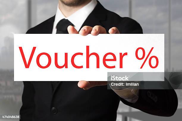 Businessman Holding Sign Voucher Percentage Symbol Stock Photo - Download Image Now - 2015, Adult, Advertisement