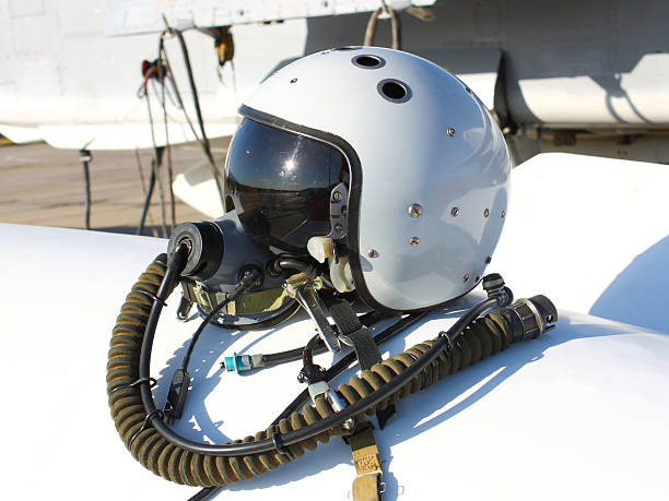 Protective helmet of the pilot Protective helmet of the pilot against the plane with an oxygen mask on a fuel tank oxygen mask plane stock pictures, royalty-free photos & images