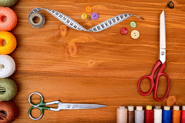 istock Copyspace frame with sewing tools and accesories on wooden background 474055678