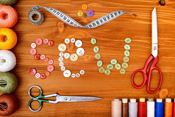 istock Frame with sewing tools and accesories on wooden background 474055684