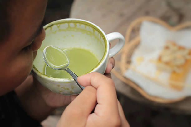 istock The boy is drinking green tea and milk. 474056514