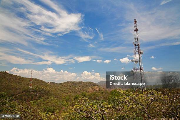 Tall Telecommunication Tower Against Blue Sky Stock Photo - Download Image Now - 2015, Blue, Broadcasting