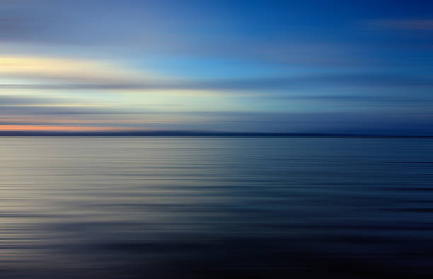 istock Colorful sunset with long exposure effect, motion blurred 474058419