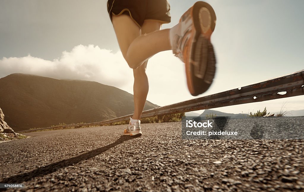 Her legs are unstoppable Cropped shot of an athlete running along a roadhttp://195.154.178.81/DATA/i_collage/pu/shoots/804604.jpg 2015 Stock Photo