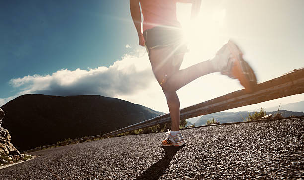 Cropped shot of an athlete running along a roadhttp://195.154.178.81/DATA/i_collage/pu/shoots/804604.jpg