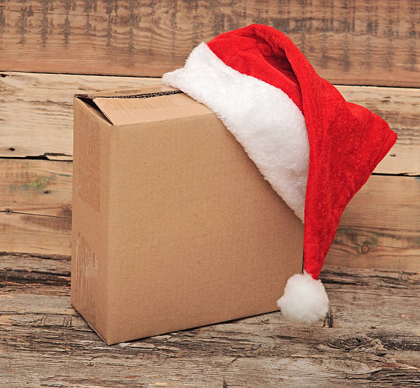 istock Christmas present with santa hat close up 474059587