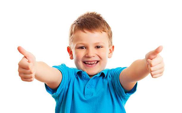 istock Cute boy  showing thumbs up on white background 474063111