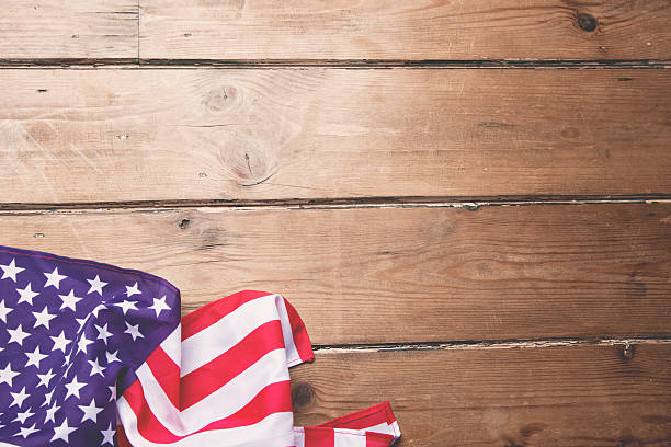 istock American flag on wooden background 474063655