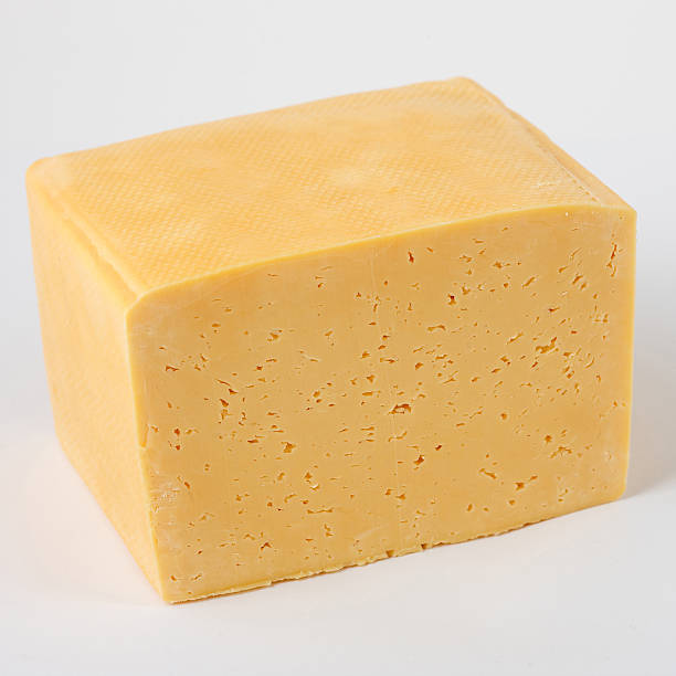 istock slab of cheese on white background 474064202