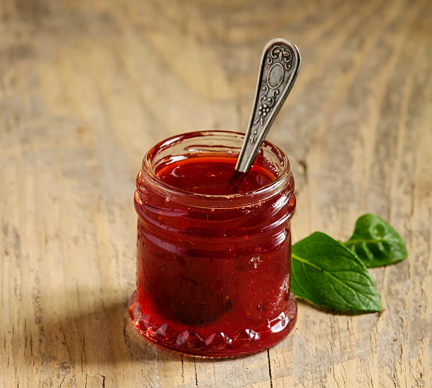 istock Delicious homemade strawberry jam in a jar, selective focus 474067438