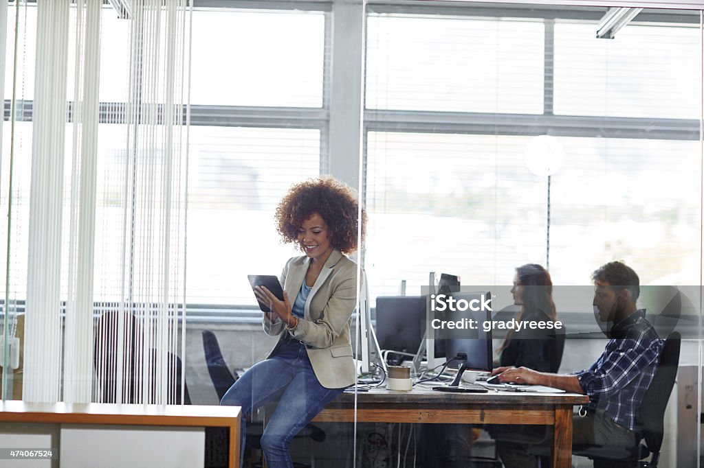 Checking the latest business news feeds Cropped shot of a beautiful young businesswoman using her tablet in the officehttp://195.154.178.81/DATA/i_collage/pu/shoots/804645.jpg 2015 Stock Photo