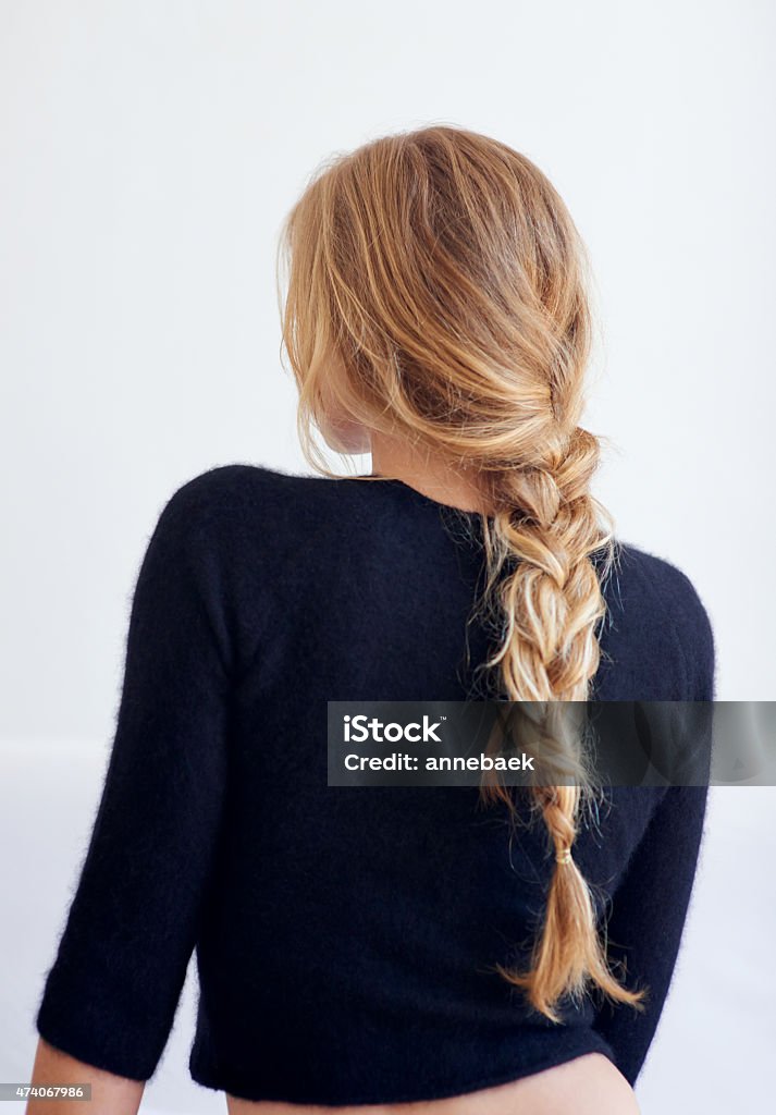 Back to the basics Rearview shot of woman with a plaited hairstylehttp://195.154.178.81/DATA/i_collage/pu/shoots/804598.jpg Braided Hair Stock Photo