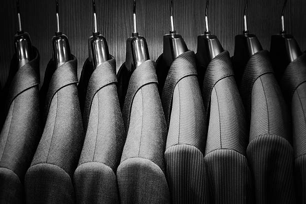 Row of men suit jackets. Row of men suit jackets. Black and white image. coathanger photos stock pictures, royalty-free photos & images