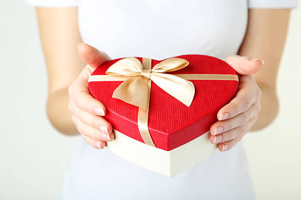istock Female hands holding gift box 474069226