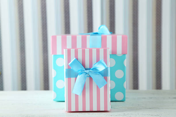 istock Beautiful gift boxes on white wooden background 474069264
