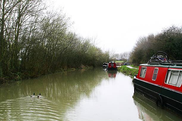 istock Canal boats on river 474069416