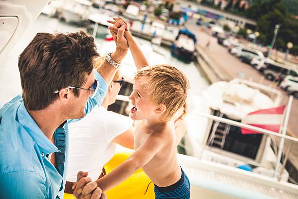 istock Happy young family and sons playing together 474069512