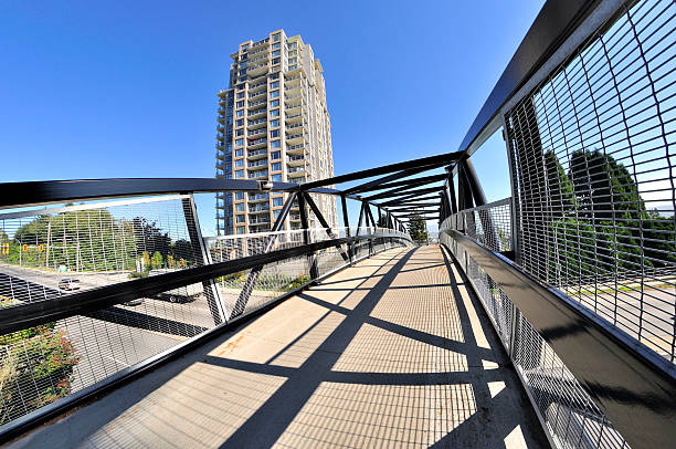 istock pedestrian  overpass with metal railing and roof 474070282