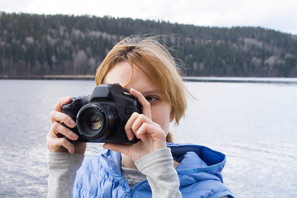 istock Woman Taking Photos with Camera 474070358