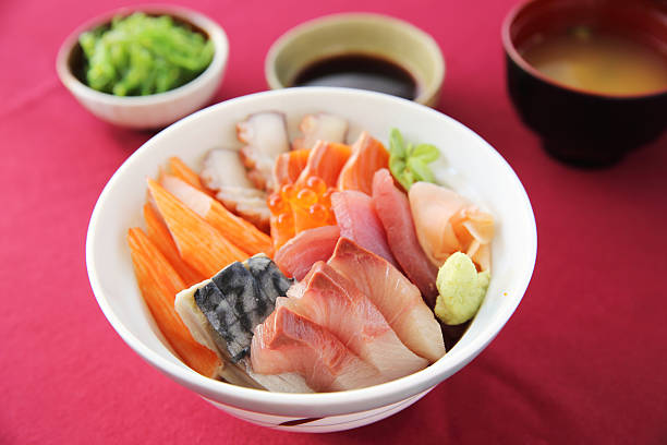 istock Sushi don , raw salmon tuna octopus on rice 474074198