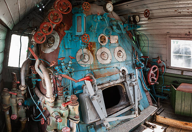 Fragment of engine room on  steam locomotive Fragment of engine room on old steam locomotive firebox steam engine part stock pictures, royalty-free photos & images