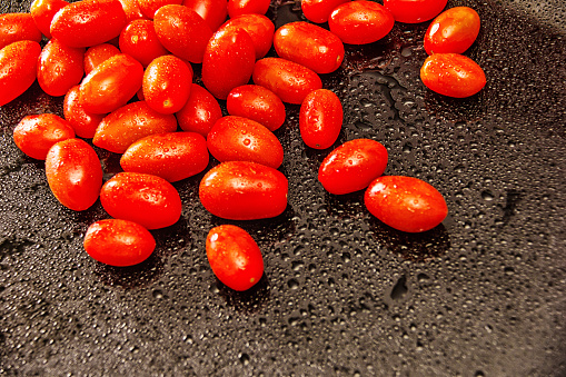 Delicate cherry tomatoes on the table. Post processing with Lightroom, Photoshop and Nick Software.