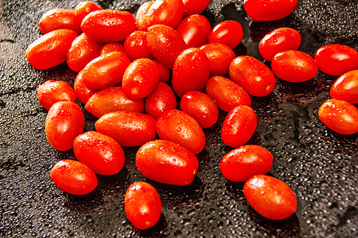 Delicate cherry tomatoes on the table. Post processing with Lightroom, Photoshop and Nick Software.