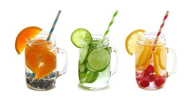 istock Detox fruit water in mason jars with straws isolated 474074994