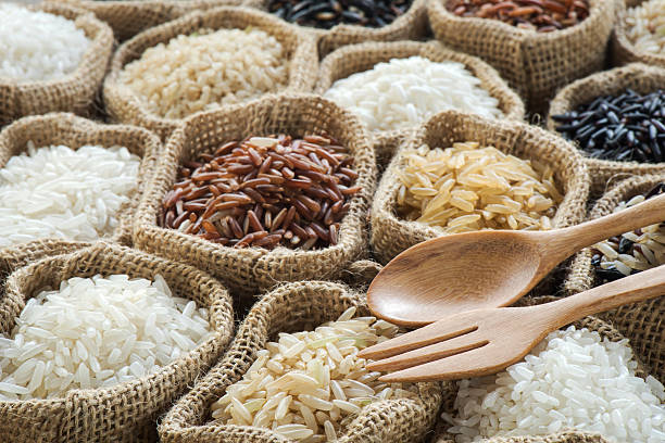 istock Group of organics rice in burlap bag 474078960