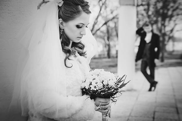 istock Elegant bride and groom posing together outdoors on a wedding 474079452