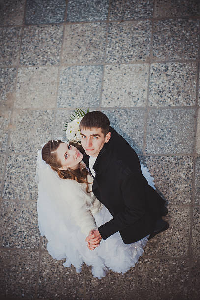 istock Elegant bride and groom posing together outdoors on a wedding 474080450