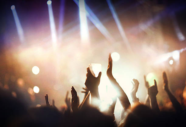istock Large group of people at concert. 474080540