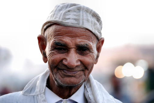 Marrakesh, Morocco - September 29, 2011: Elderly Moroccan Man in a Djellaba An elderly man wearing a traditional djellaba in old part of Marrakesh