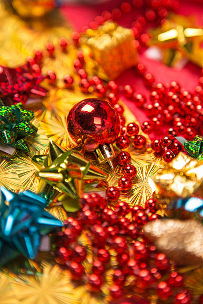 istock small red ball  near golden gift-box red bead and bow 474083078