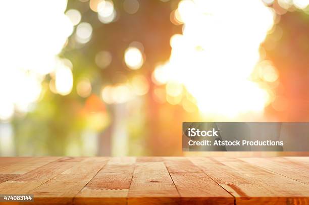 Wood Table Top On Shiny Sunlight Bokeh Background Stock Photo - Download Image Now - Table, Backgrounds, Sunlight