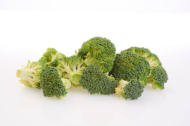 broccoli fresh green broccoli vegetables on white backgroundHealthy Green Organic Broccoli isolated on Black broccoli crowns stock pictures, royalty-free photos & images
