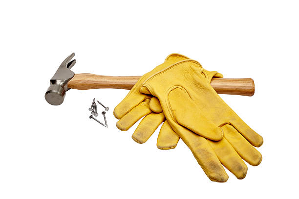 istock Hammer, nails and work gloves isolated on white 474084566