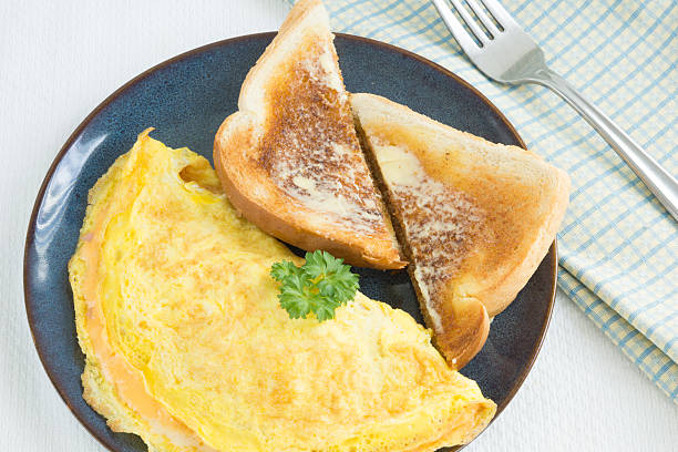 istock ready to eat omelette for breakfast with white bread 474085330