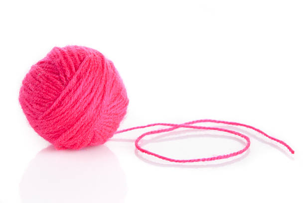 istock Pink Yarn Ball  on white background 474087047