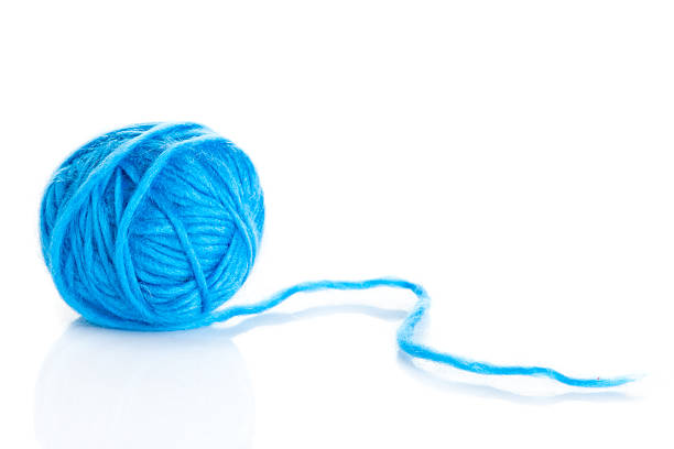 istock Blue Ball of knitting yarn on a white background 474087067
