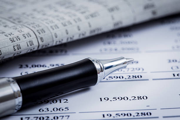 istock pen resting on world currency figures 474087751