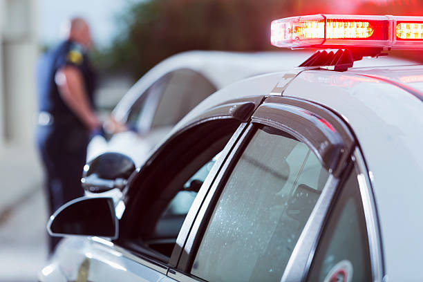 Police officer pulled over driver for traffic violation stock photo