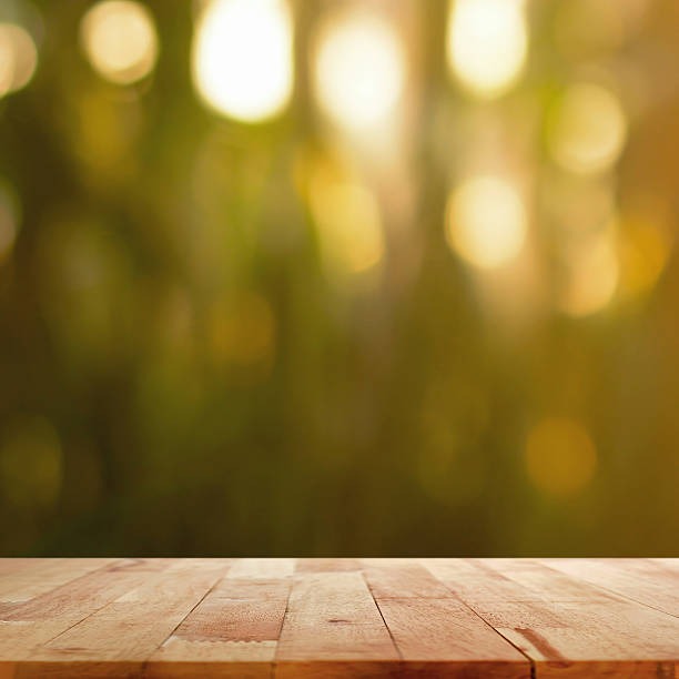 istock Wood table top on blur dark green background 474088382